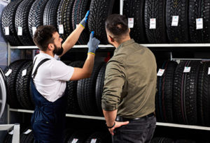 Town Fair Tire Salesperson With Tires